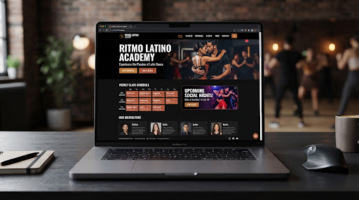 Ritmo Latino Academy website live staging on MacBook Pro inside dark boutique dance studio background